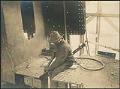Image of Moran Brothers employee operating a compressed air chipping gun, Seattle, circa 1902