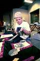 Image of Wayne Blakely working on an AIDS quilt, November 29, 1991