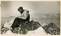 Image of Lloyd Anderson resting on Howser Spire, British Columbia, 1941