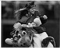 Image of Mariner Moose carrying Amy Martin around infield at the Kingdome, April 16, 1990