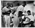 Image of Ken Griffey Sr. and Ken Griffey Jr. in Mariners dugout, April 1991