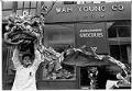 Image of Lion dancers lifting costume on S. King Street, Seattle, January 15, 1989