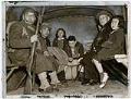 Image of Japanese Americans from Bainbridge Island in back of military truck, March 31, 1942