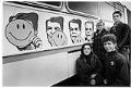 Image of Artists posing with their political ad campaign on Metro bus, Seattle, October 23, 1984