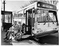 Image of George Turner demonstrating a wheelchair lift aboard a Metro bus, Seattle, April 14, 1985