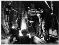 Image of Jim Lukehart investigating an electrical connection in bus tunnel, Seattle, December 12, 1988