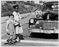 Image of Two girls crossing street near Madrona School, Seattle, September 1957