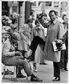 Image of Norm Rice getting a shoeshine near Westlake Mall, Seattle, September 17, 1985