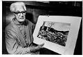 Image of Floyd Schmoe with photo of Hiroshima, November 20, 1983