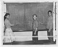 Image of Three students doing math on blackboard at Meany Jr. High, Seattle, October 3, 1958