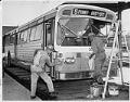 Image of Workmen cleaning transit bus, Seattle, May 16, 1963