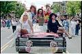 Image of Group posing on car during Pride parade, Seattle, June 27, 1993