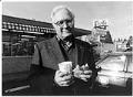 Image of Dick Spady in front of Dick's Drive-In on 45th, Seattle, December 21, 1993