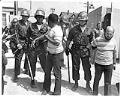 Image of Tyree Scott and Sam Martinez being arrested during UWCA protest, Seattle, June 8 1972