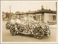 Image of Treat family in car decorated for Golden Potlatch parade, Seattle, 1912