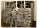 Image of Employee working in the stockroom at Crescent Manufacturing Company, Seattle, circa 1923