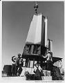 Image of Space Needle leg being set on base, 1961