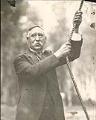 Image of Morgan J. Carkeek ringing bell, Carkeek Park, Seattle, circa 1920