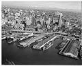 Image of Aerial view of Seattle waterfront, showing Polynesian Restaurant on Pier 51, October 13, 1961