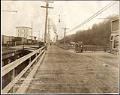 Image of Alki Avenue with railroad tracks and flour mill, Seattle, February 19, 1913