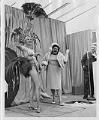 Image of Donna Rydberg, Gracie Hansen and John Eaton on stage at Century 21 groundbreaking event, 1961