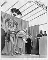 Image of Donna Rydberg in costume on stage with John Eaton and Gracie Hansen, 1961
