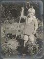 Image of Alfred Renfro, Jr. playing in garden at Beaux Arts Village, circa 1910