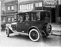 Image of Yellow cab in front of Perfection Tires, Seattle, circa 1920