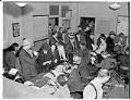 Image of Japanese Americans surrendering equipment to police, Seattle, December 29, 1941