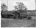 Image of U. S. soldiers and Nakamura family loading Army truck for forced removal, Bainbridge Island, March 30, 1942