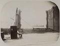 Image of Man guarding a safe after Great Seattle Fire, June 6, 1889