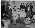 Image of Eight Japanese American children returning from incarceration camps, November 8, 1945