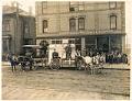 Image of Suess Art Glass employees posing outside store, Seattle, circa 1908