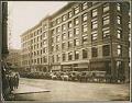 Image of Colman Building, with Lough, Augustine & Co.'s grocery wagons, Seattle, circa 1900
