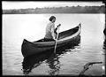 Image of Woman paddling canoe on Green Lake, Seattle, 1923