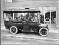 Image of Michael Carzes and others sitting in a jitney, Seattle, circa 1919