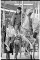 Image of Girl riding carousel at Fun Forest, Seattle Center, March 25, 1967