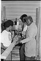 Image of Boys Club members and instructor building shelving, Seattle, August 11, 1970
