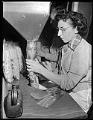 Image of Woman packaging pasta at Mission Macaroni Co., Seattle, January 1952