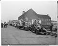 Image of Funeral cars processing down King Street, Seattle, November 28, 1941