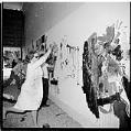 Image of Merrily Dam painting mural at Seattle Center, June 1, 1963