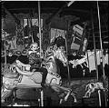 Image of Girl riding carousel at Fun Forest, Seattle Center, September 1965