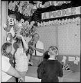 Image of Boy playing carnival game at Fun Forest, Seattle Center, June 1963