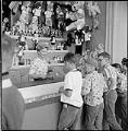 Image of Boys playing carnival game at Fun Forest, Seattle Center, June 1963
