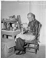 Image of John Butler polishing silver at Goodwill, Seattle, October 15, 1946