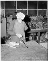 Image of Goodwill employee repairing shoes, Seattle, circa 1960