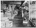 Image of Capeloto brothers unloading fruit at market, Seattle, November 4, 1948