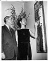 Image of Guy Anderson and Mrs. Ray Collins at the Otto Seligman Gallery, March 7, 1965