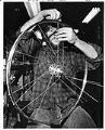 Image of Glenn Erickson working at R&E Cycles, Seattle, May 10, 1974
