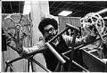 Image of Angel Rodriquez with bicycle frame at R&E Cycles, Seattle, May 10, 1974